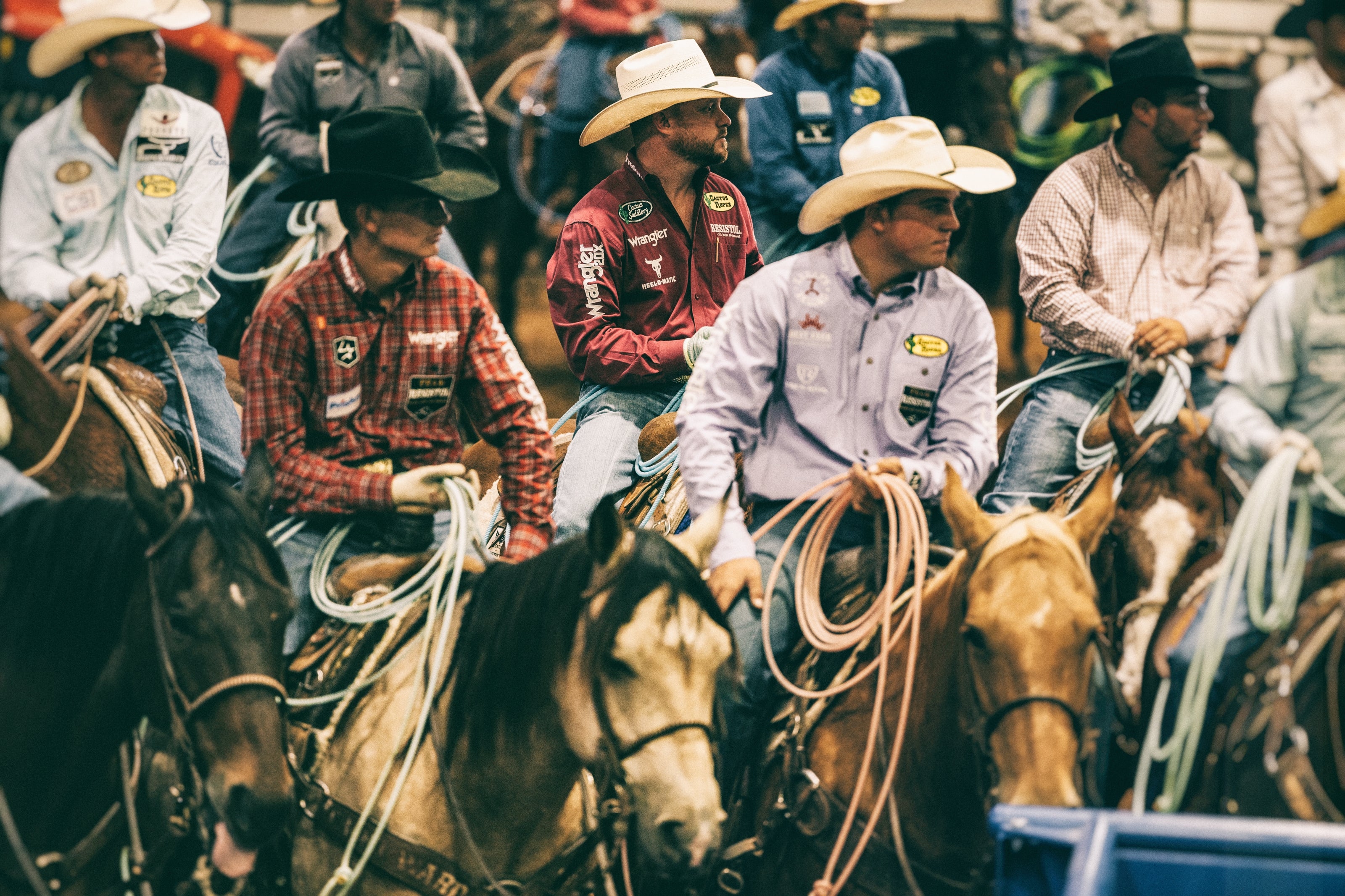 Wranglers sitting on horses